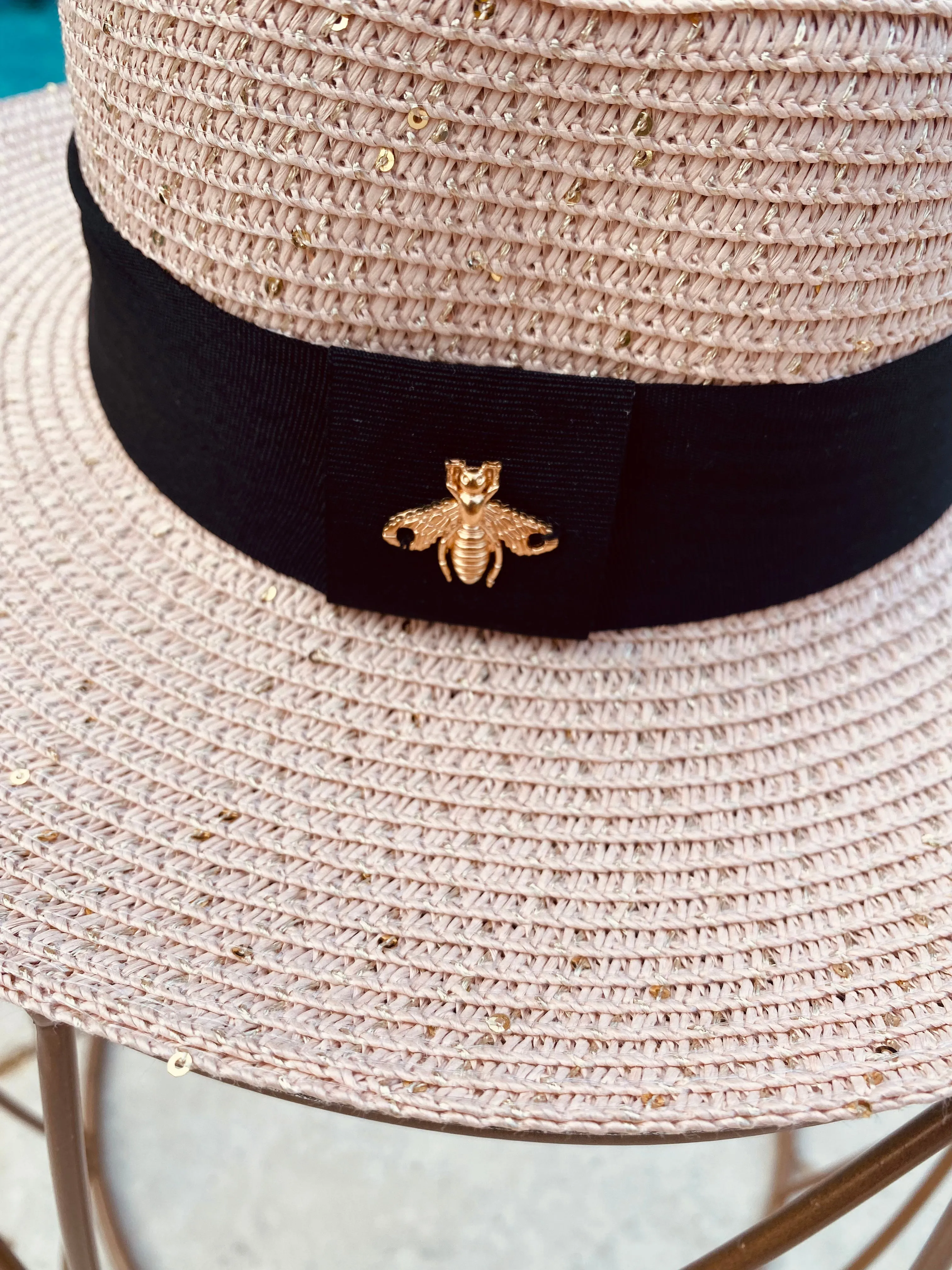 BLUSH SHIMMERY SUN LADIES ADJUSTABLE HAT WITH BLACK BAND AND GOLD BEE CHARM